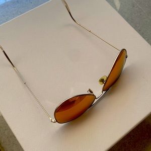 Ray-Ban Mirrored Sunglasses with bronze lens and silver frames.